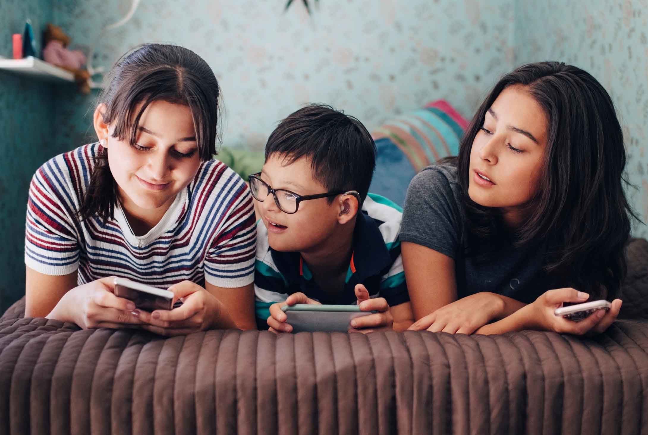 Teenagers playing video games